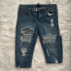 Mid rise distressed denim skinny jeans